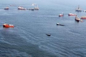 Oil sheen is seen with vessels assisting close to the source of the BP Deepwater Horizon oil spill on July 18, 2010 into the gulf coast of florida - Mario Tama/Getty photographs News/Getty graphics