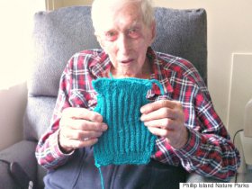 oldest man knits penguin sweater