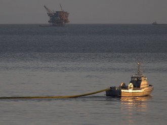 PICTURE: a watercraft with the nonprofit collective Clean Seas deploys a growth, with an oil system seen in the length, to try and consist of an oil spill  may 19, 2015 north of Goleta, California.